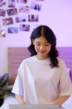 Smiling Girl Programming on Laptop 写真素材