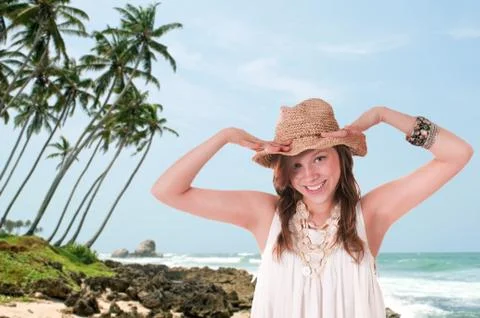 Smiling girl in straw hat Stock Photos