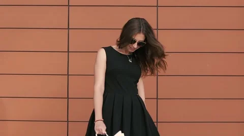 Smiling girl turns around with shopping bags Stock Footage