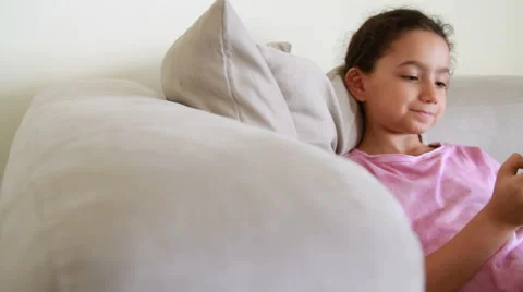 Smiling girl using iphone 6 Stock Footage 51745290