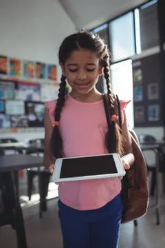 Smiling girl using tablet computer Foto stock