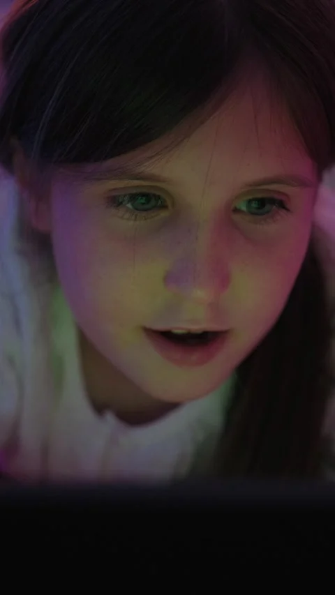 Smiling Girl Watching Tablet in Dark Room at Bedtime Stock Footage 345528458