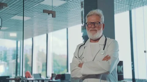 A smiling, gray-haired old doctor Stock Footage 158226909