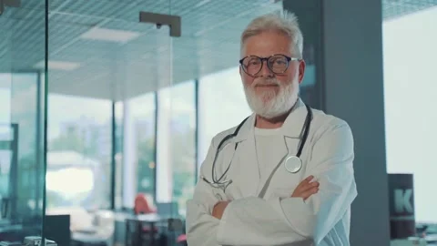 A smiling, gray-haired old doctor Stock Footage 158667693