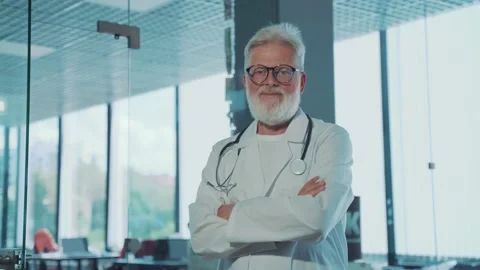 A smiling, gray-haired old doctor Stock Footage 160363760