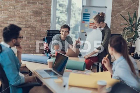 Smiling group of colleagues are developing enterprise strategy Stock Photos