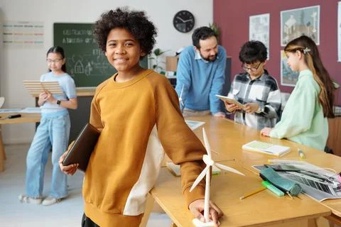 Smiling Group Of Multiracial Students Working In Classroom Stock Photos