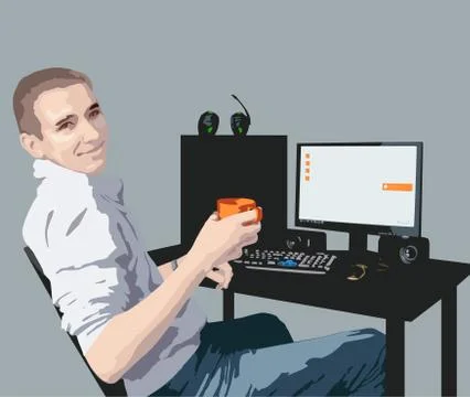 Smiling guy sitting at a desk with a computer Stock Photos