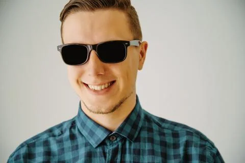 Smiling guy in sunglasses Stock Photos