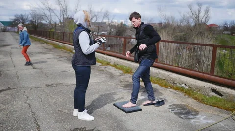 Smiling guy trying to get on board with nails Stock Footage 68348575