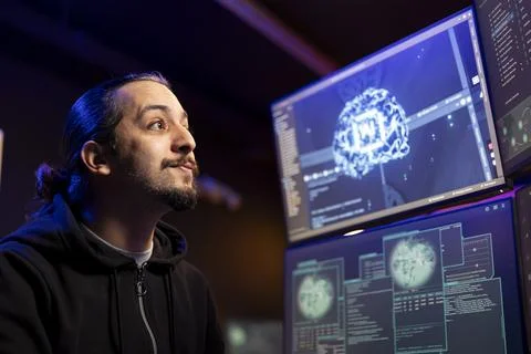 Smiling hacker installing spyware with AI to secretly gather data about user Stock-Fotos
