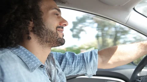 Smiling handsome man driving car happy Stock Footage 43594729