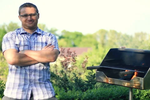 Smiling handsome man with grill, dolly shot Stock Footage