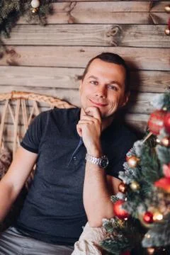 Smiling handsome man looking at camera. Cheerful good-looking man in t-shirt Stock Photos