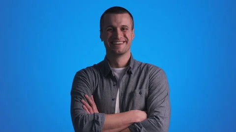 The smiling handsome man posing on camera. slow motion Stock Footage 151653111