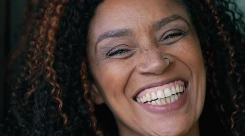A smiling happy black woman portrait face a Brazilian hispanic person Stock Photos