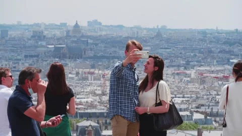 Smiling, happy couple take romantic selfie with panoramic city view Stock Footage 308207996