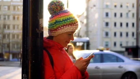 Smiling happy woman chatting using her mobile phone under the sunlight Видео 72822972