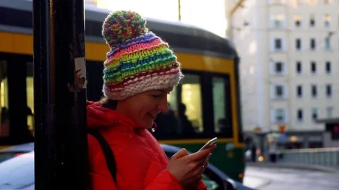 Smiling happy woman chatting using her mobile phone under the sunlight Stock Footage 72823959