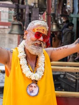 Smiling Hindu Devotee Wearing Flower Garland And Sacred ram Tilak Portrait .. 写真素材