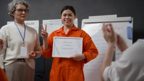 Smiling Hispanic Inmate Accepting Certificate at Graduation Ceremony Stock Footage 329002015
