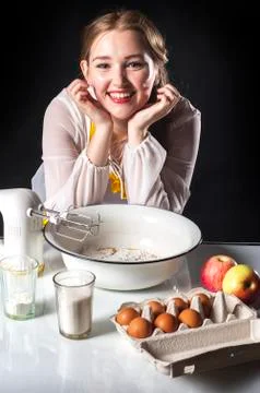 Smiling homemaker in kitchen Stock Photos