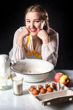 Smiling homemaker in kitchen Stock Photos