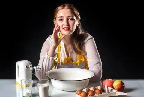Smiling homemaker in kitchen Stock Photos