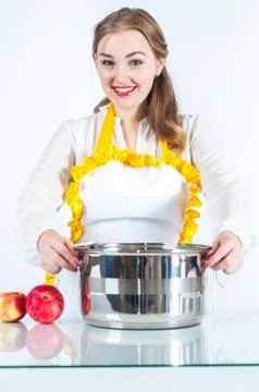 Smiling homemaker with pan Stock Photos