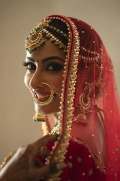 Smiling Indian Bride looking at the camera with a smile	 Stock Photos