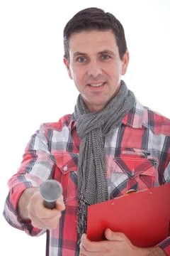 Smiling interviewer holding out a microphone Stock Photos
