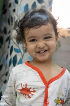 Smiling kid innocent facial expression at indoor at night 写真素材
