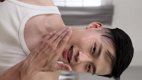 Smiling Korean male looking at camera Stock Footage 227099766