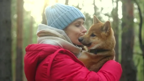 Smiling lady taking free time with her dog. Video stock 255836788