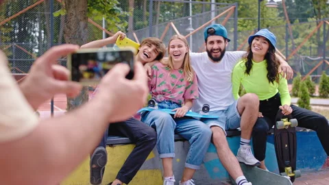 Smiling large group of multiethnic friends posing in front of the camera one of Stock-Footage 135969278