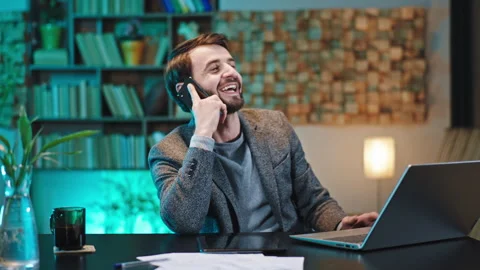 Smiling large office worker at his work place speaking on the phone and feeling Stock Footage 144202683