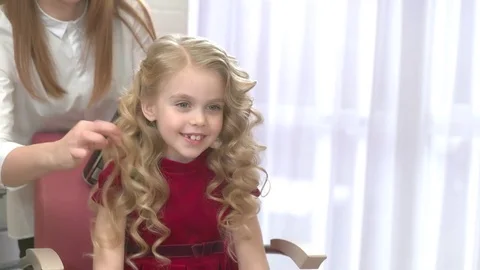 Smiling little girl, hair salon. Stock Footage