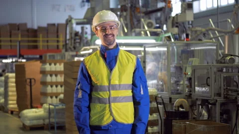Smiling male worker in the functioning factory facility Video stock 104210102