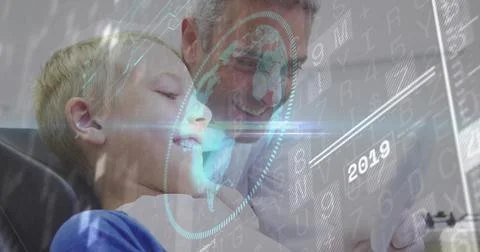 Smiling man and boy exploring holographic tablet display in living room, with Stock Photos