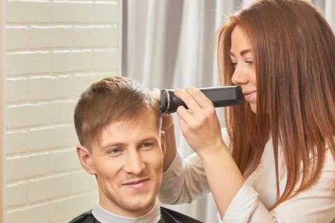 Smiling man at the barber. Stock Photos