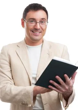 Smiling man with a  book Stock-Fotos