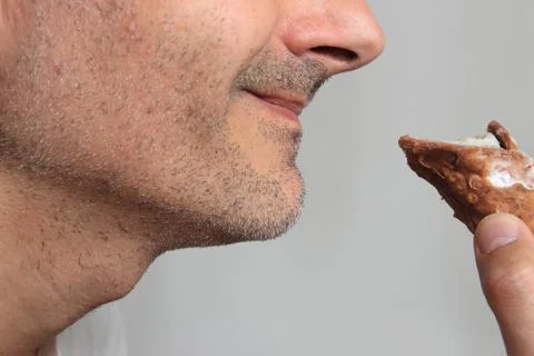 Smiling man cannolo Stock Photos