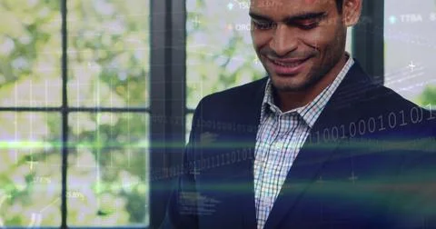Smiling man in dark-suit checked-shirt glancing down at grid window with data Stock Photos