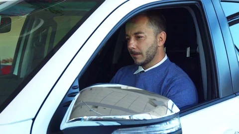 The smiling man examines car interior Stock Footage 82829874