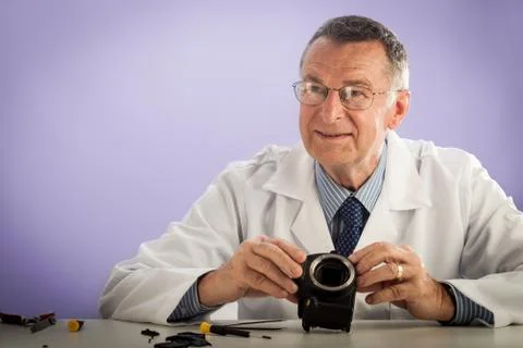 Smiling man fixing camera Foto stock