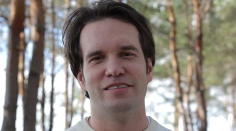 Smiling Man on the Forest Background 스톡 동영상 53851102