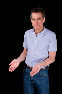 Smiling man hands forward demonstrating something Stock Photos