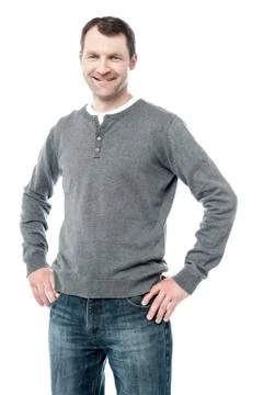 Smiling man with hands on hips Stock Photos