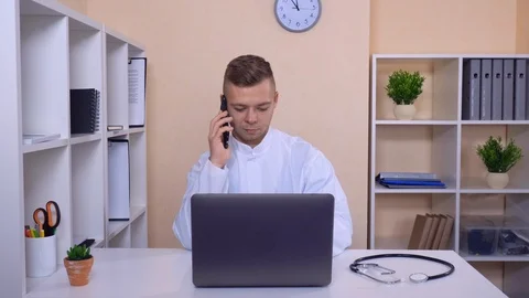 Smiling man has phone conversation on mobile Stock Footage 86253398
