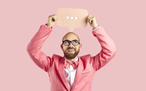 Smiling man hold speech bubble with dots Stock Photos